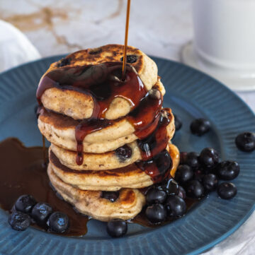 Blueberry Sourdough Pancakes with Maple Syrup.