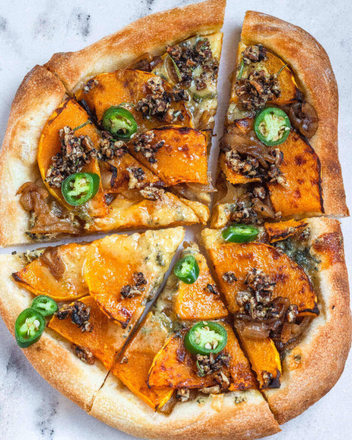 Homemade pizza with butternut squash and caramelised onion sliced into six pieces